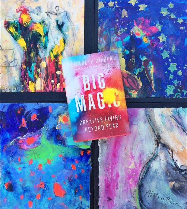 Elizabeth Gilbert's Big Magic on a background of paintings by Suzanne Edminster